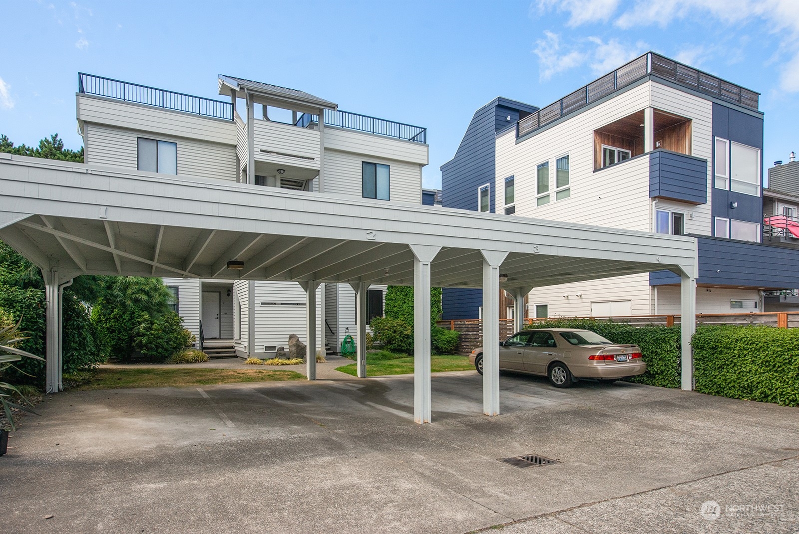 3030 63rd Avenue Southwest, Unit 2 Seattle, WA 98116 - Photo 28 of 32 a car parked in front of a building