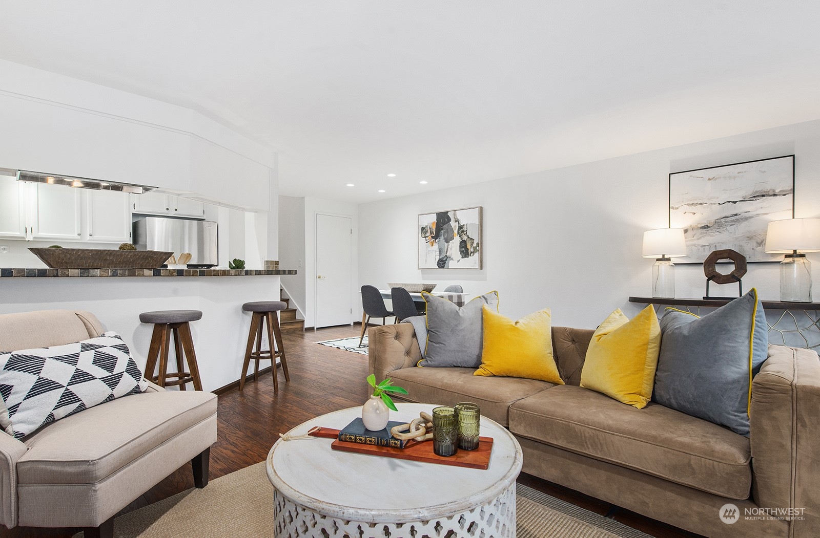 3030 63rd Avenue Southwest, Unit 2 Seattle, WA 98116 - Photo 8 of 32 a living room with furniture and kitchen view
