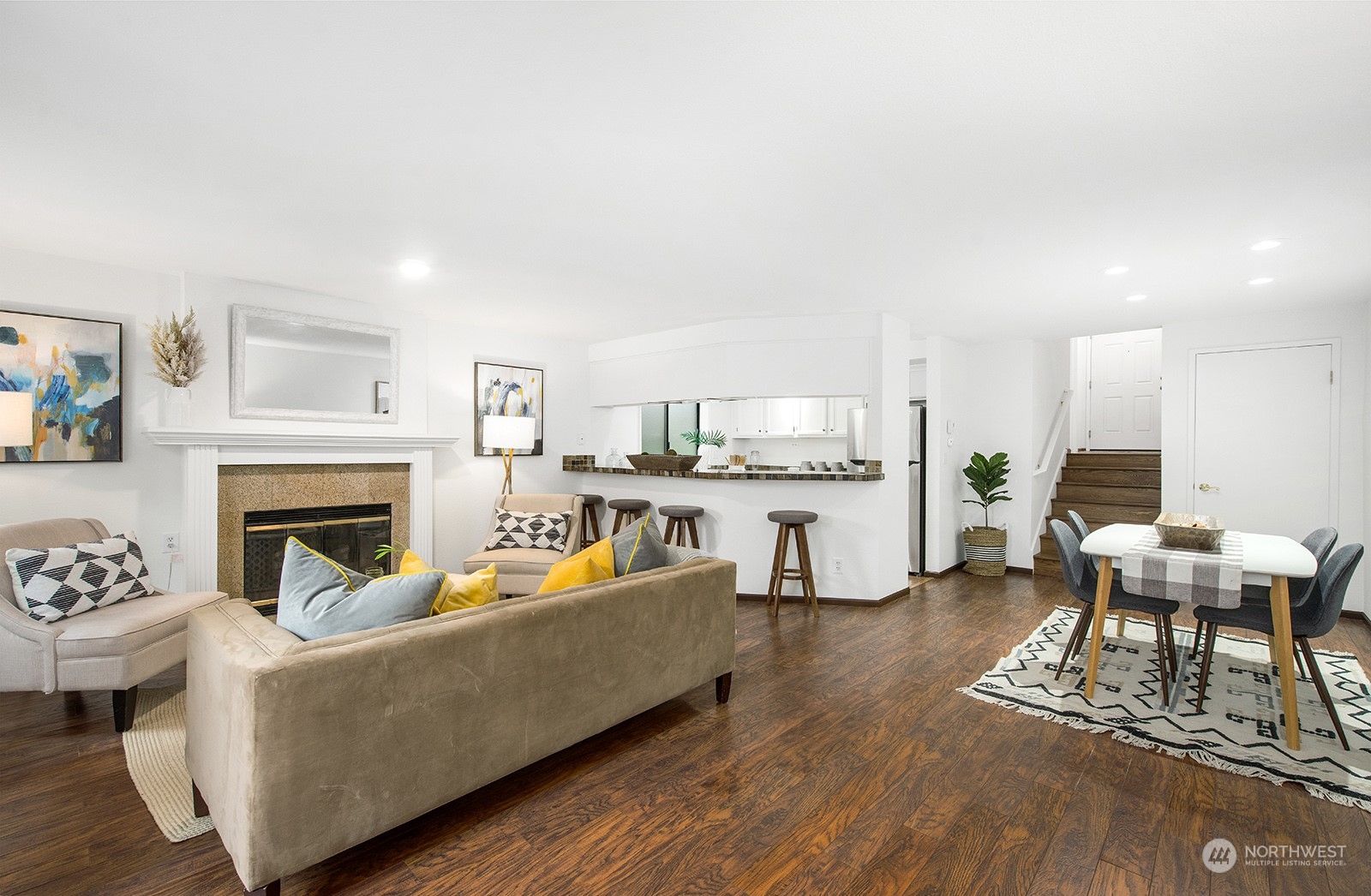 3030 63rd Avenue Southwest, Unit 2 Seattle, WA 98116 - Photo 9 of 32 a living room with furniture and a fireplace