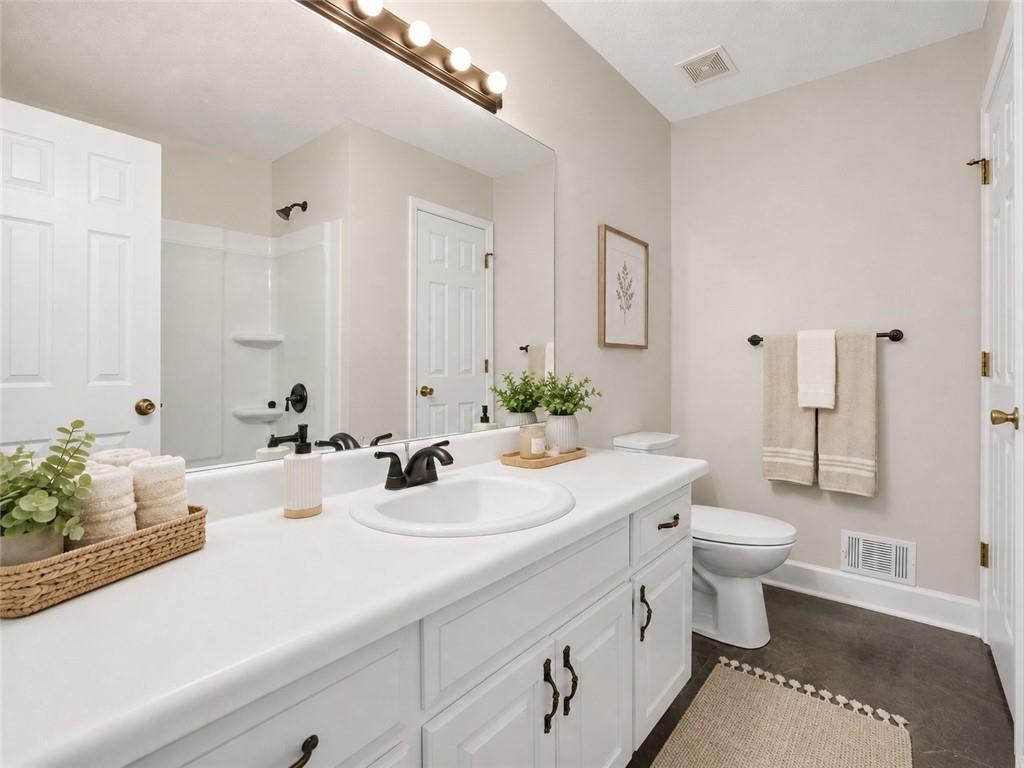 314 Coady Road Jackson, GA 30233 - Photo 11 of 31 a bathroom with a sink and a mirror
