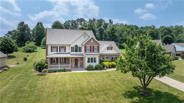 a aerial view of a house with swimming pool yard and outdoor seating