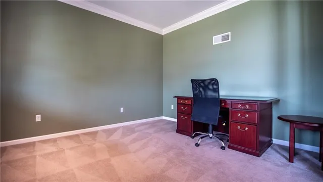 a view of a workspace with furniture