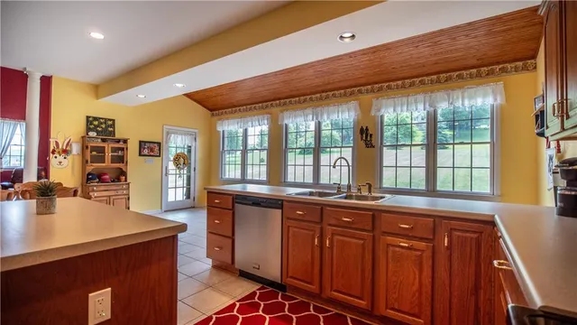 a kitchen with a stove a sink and a microwave