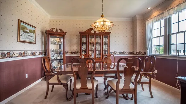 a big yard with lots of green space and wooden fence