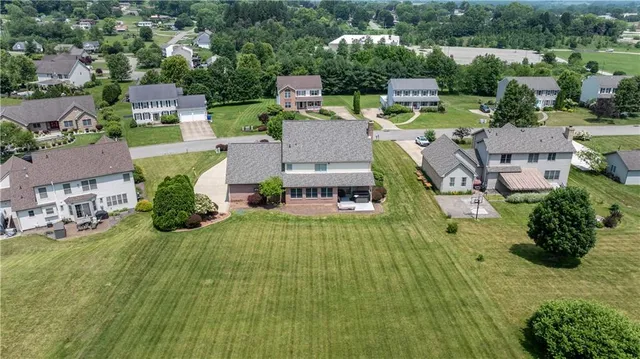 an aerial view of a house with a garden