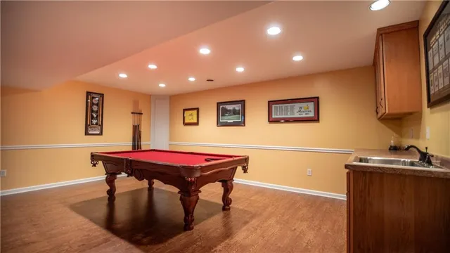 a view of a kitchen with stainless steel appliances granite countertop a stove and a microwave