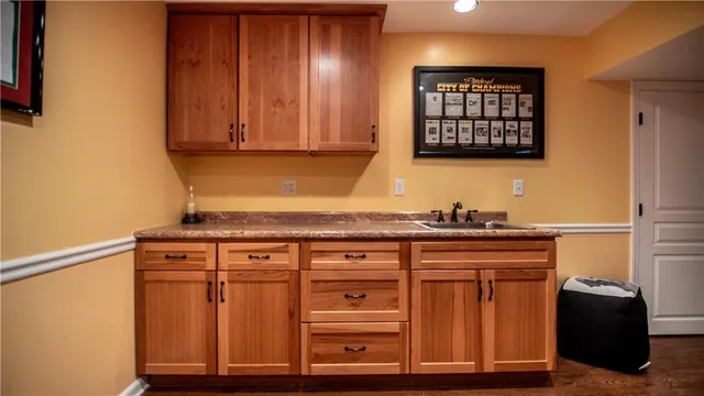 a kitchen with a table and chairs in it