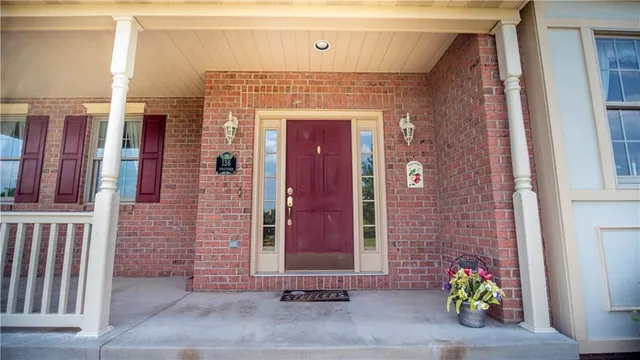 a front view of a house with outdoor seating