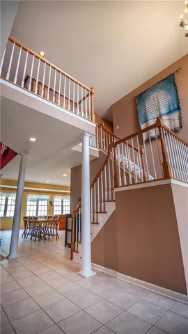 a view of an entryway with a staircase