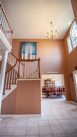 a view of kitchen with furniture and a chandelier