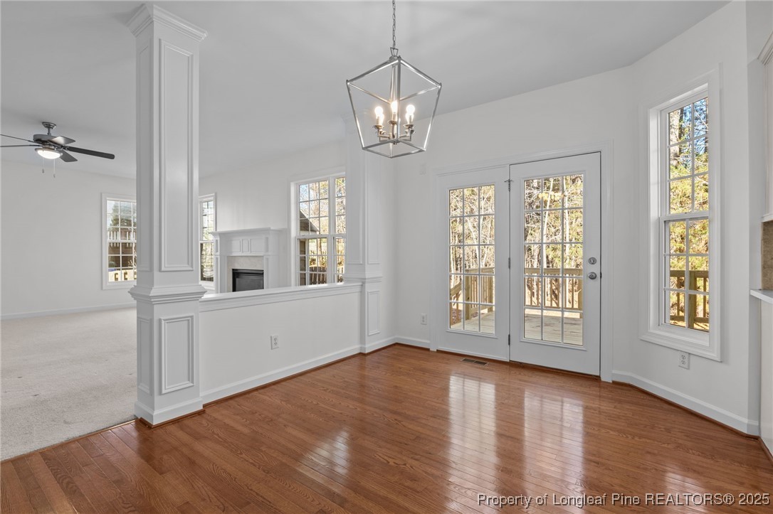 4518 Paces Ferry Drive Durham, NC 27712 - Photo 20 of 44 a view of an empty room with a window and wooden floor