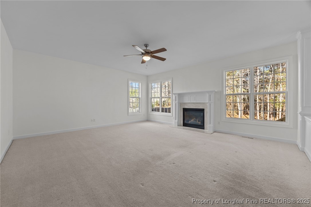 4518 Paces Ferry Drive Durham, NC 27712 - Photo 21 of 44 an empty room with windows and fireplace