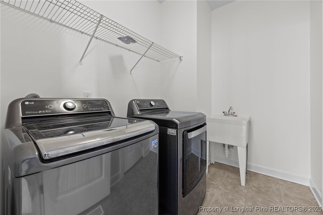 4518 Paces Ferry Drive Durham, NC 27712 - Photo 24 of 44 a utility room with dryer and washer