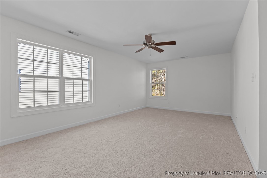 4518 Paces Ferry Drive Durham, NC 27712 - Photo 31 of 44 a view of room with a ceiling fan and window