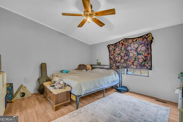 a bedroom with a bed and a table in it