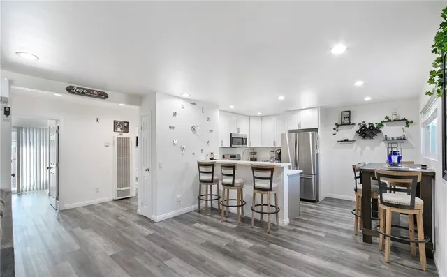 a view of a kitchen and dining room
