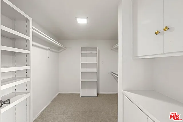 a view of an empty walk in closet