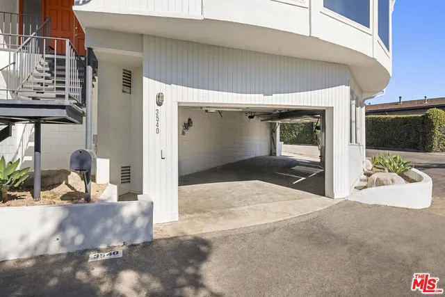 a view of a living room and a garage