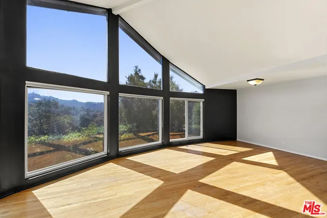 a view of a room with a large window