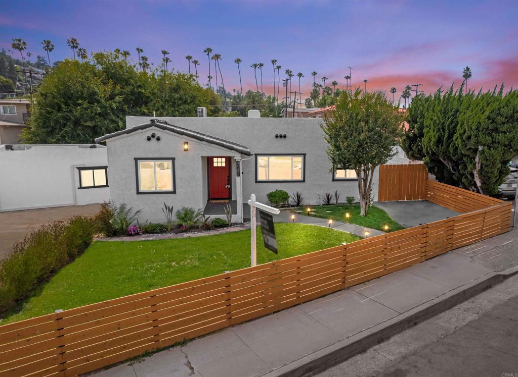 4542 Palm Avenue La Mesa, CA 91941 - Photo 1 of 55 a front view of a house with garden