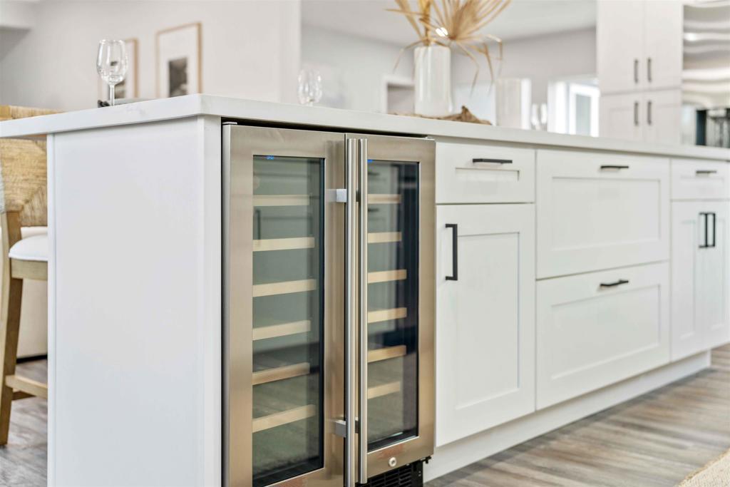 4542 Palm Avenue La Mesa, CA 91941 - Photo 14 of 55 a kitchen with a refrigerator and cabinets