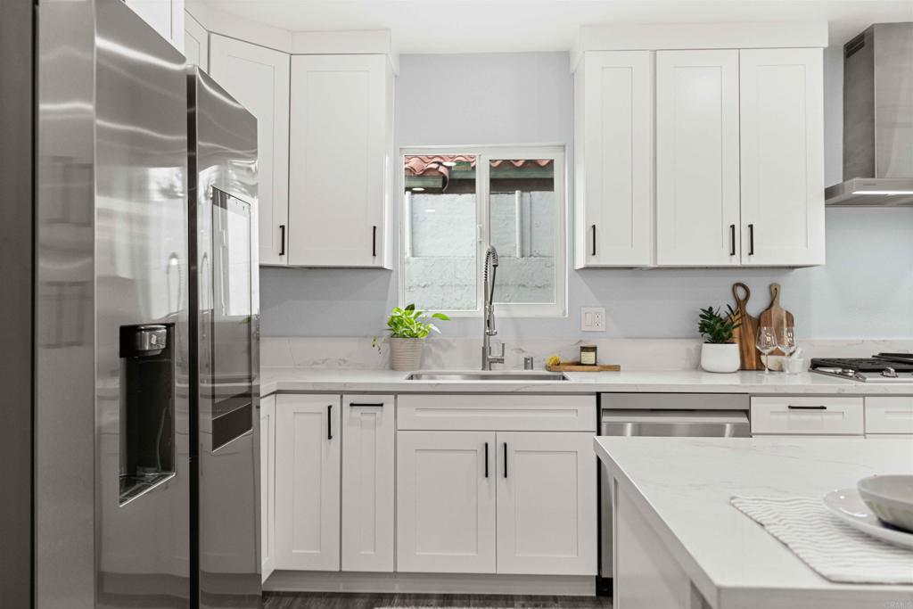 4542 Palm Avenue La Mesa, CA 91941 - Photo 16 of 55 a kitchen with white cabinets and refrigerator