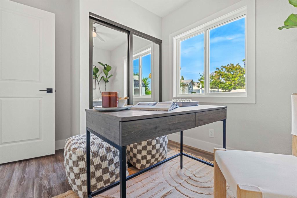 4542 Palm Avenue La Mesa, CA 91941 - Photo 20 of 55 a room with a table a chair and wooden floor