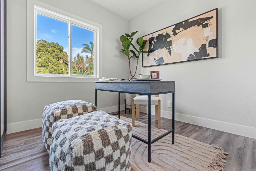 4542 Palm Avenue La Mesa, CA 91941 - Photo 21 of 55 a bedroom with a bed and a painting on the wall