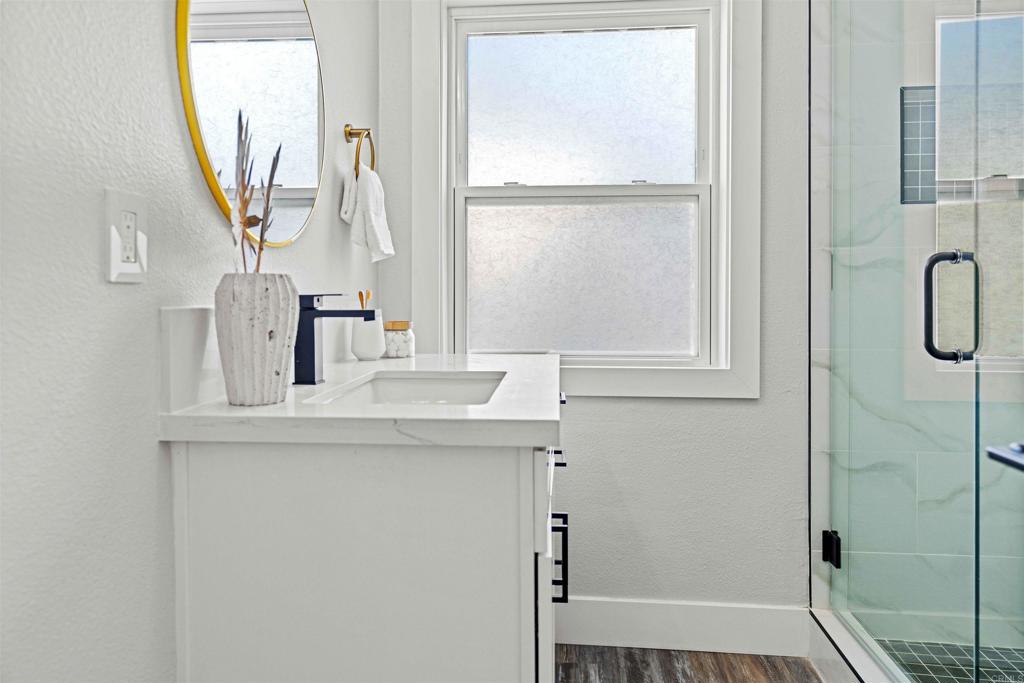 4542 Palm Avenue La Mesa, CA 91941 - Photo 22 of 55 a bathroom with a sink and a mirror