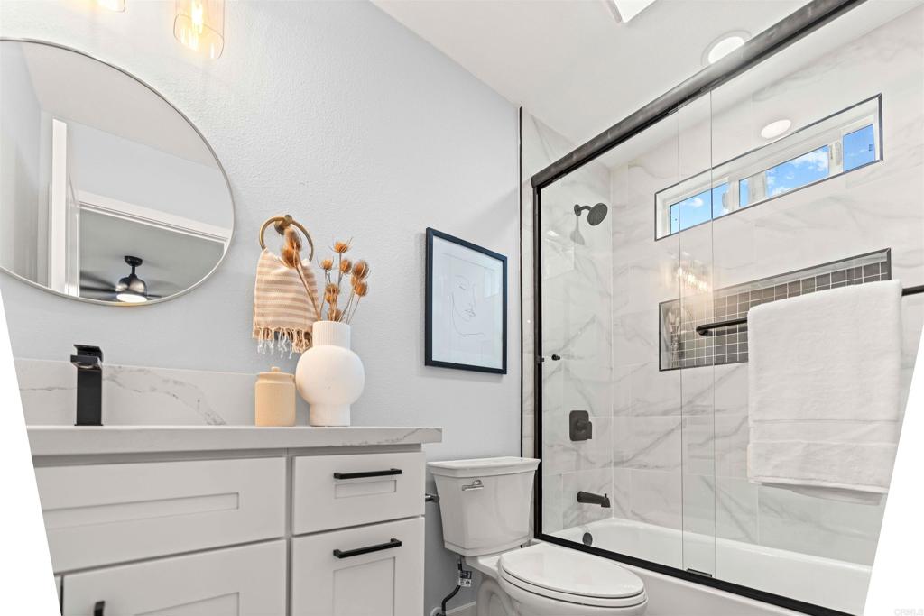 4542 Palm Avenue La Mesa, CA 91941 - Photo 29 of 55 a bathroom with a toilet sink and shower