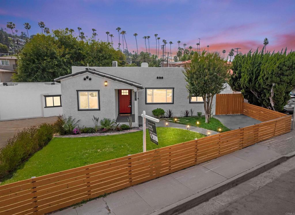 4542 Palm Avenue La Mesa, CA 91941 - Photo 3 of 55 a front view of a house with a yard