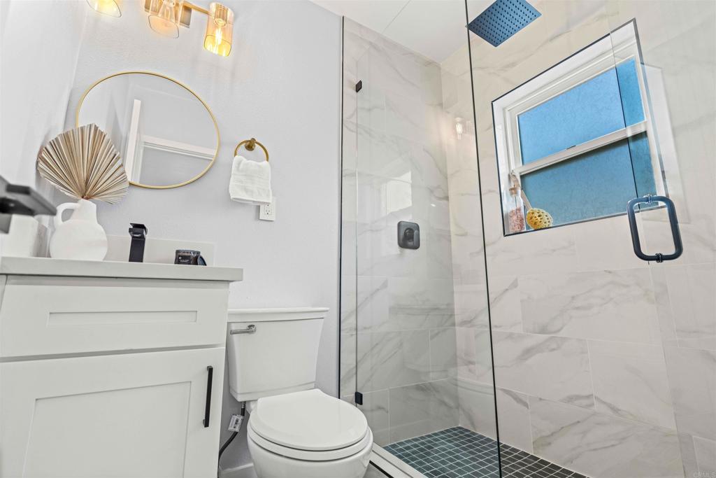 4542 Palm Avenue La Mesa, CA 91941 - Photo 31 of 55 a bathroom with a sink a toilet and shower