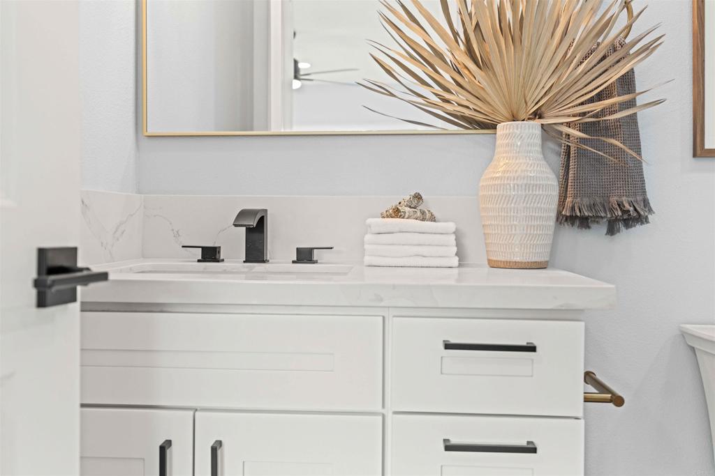 4542 Palm Avenue La Mesa, CA 91941 - Photo 34 of 55 a bathroom with a sink and a mirror