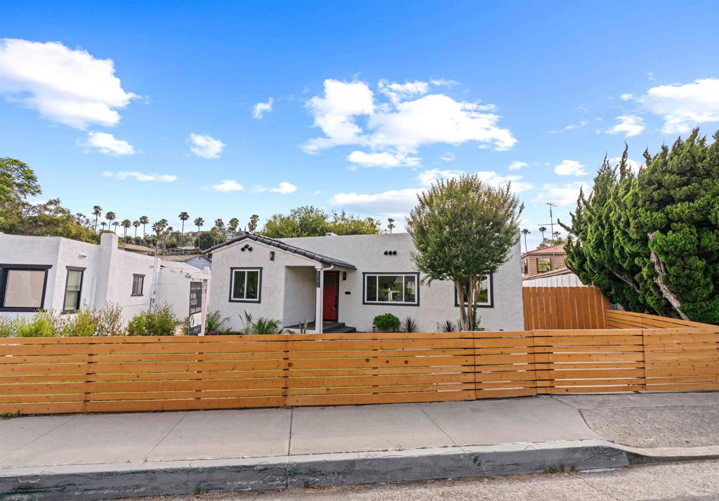 4542 Palm Avenue La Mesa, CA 91941 - Photo 4 of 55 a front view of a house with a garden
