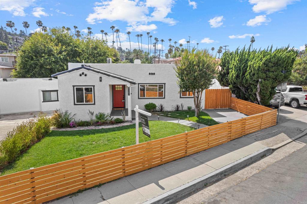 4542 Palm Avenue La Mesa, CA 91941 - Photo 46 of 55 a view of a house with a yard and potted plants