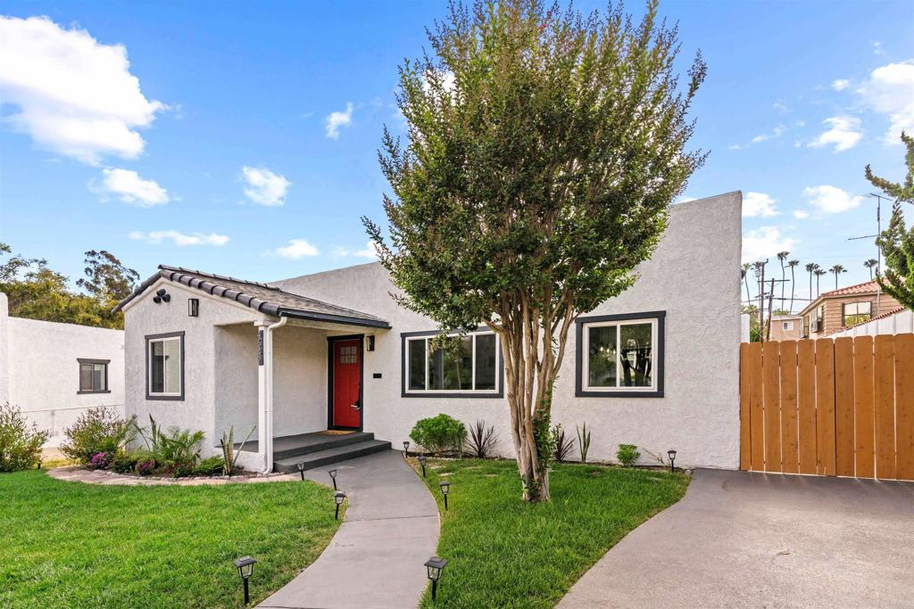 4542 Palm Avenue La Mesa, CA 91941 - Photo 5 of 55 a front view of a house with a yard