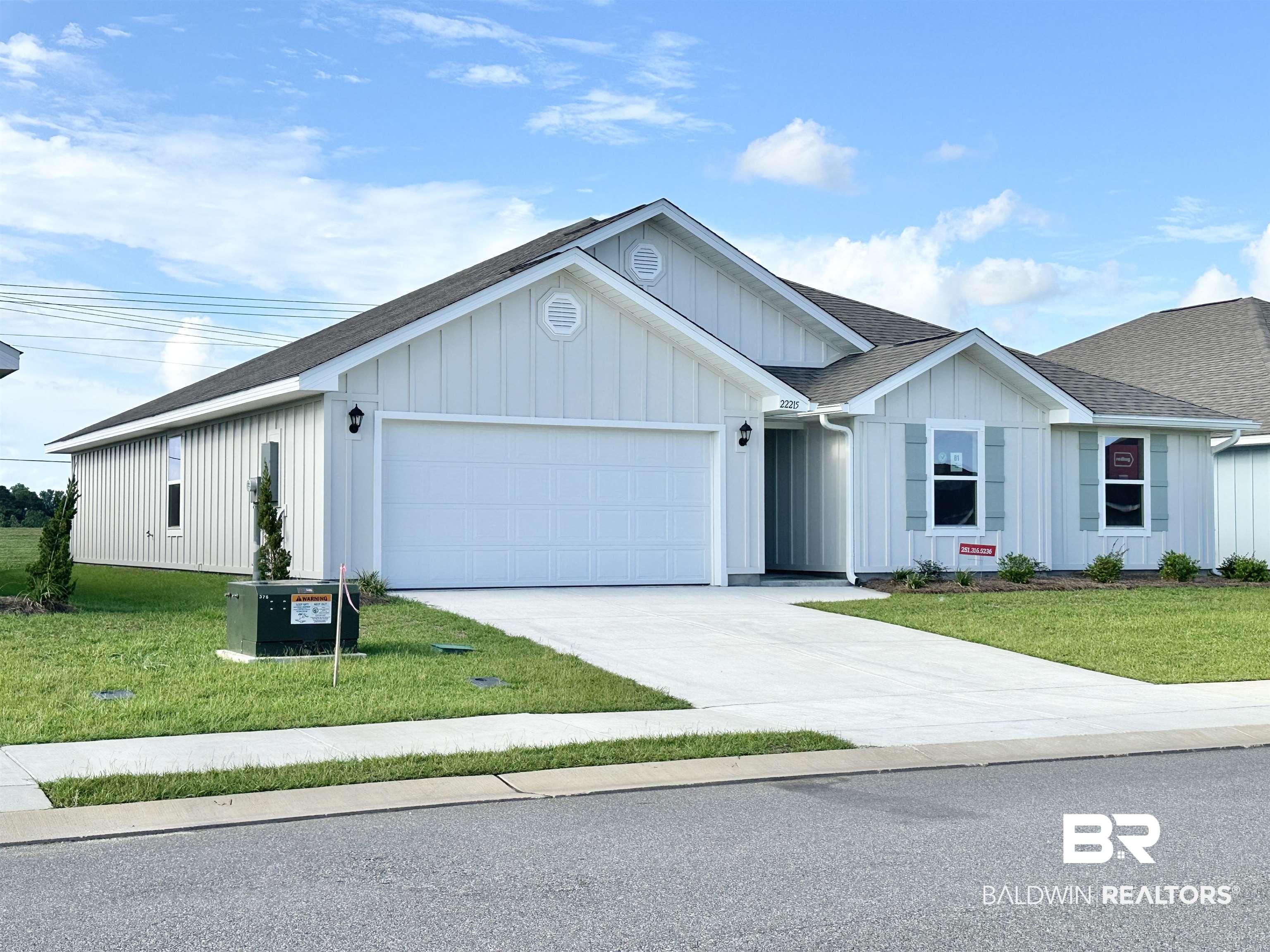 22215 Aleutian Avenue Foley, AL 36535 - Photo 2 of 34 Single story home with a garage, central air condition unit, and a front lawn