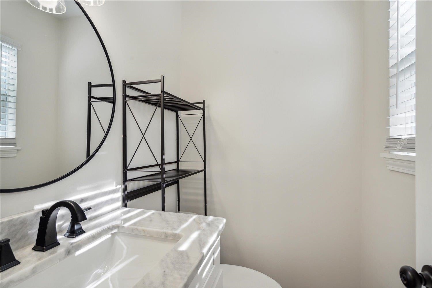 834 Greencliff Road Collierville, TN 38017 - Photo 12 of 20 a bathroom with a sink and mirror