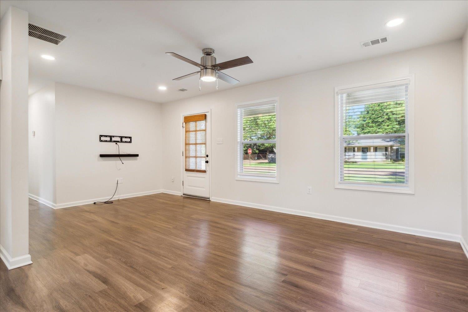 834 Greencliff Road Collierville, TN 38017 - Photo 5 of 20 a view of an empty room with a window and wooden floor