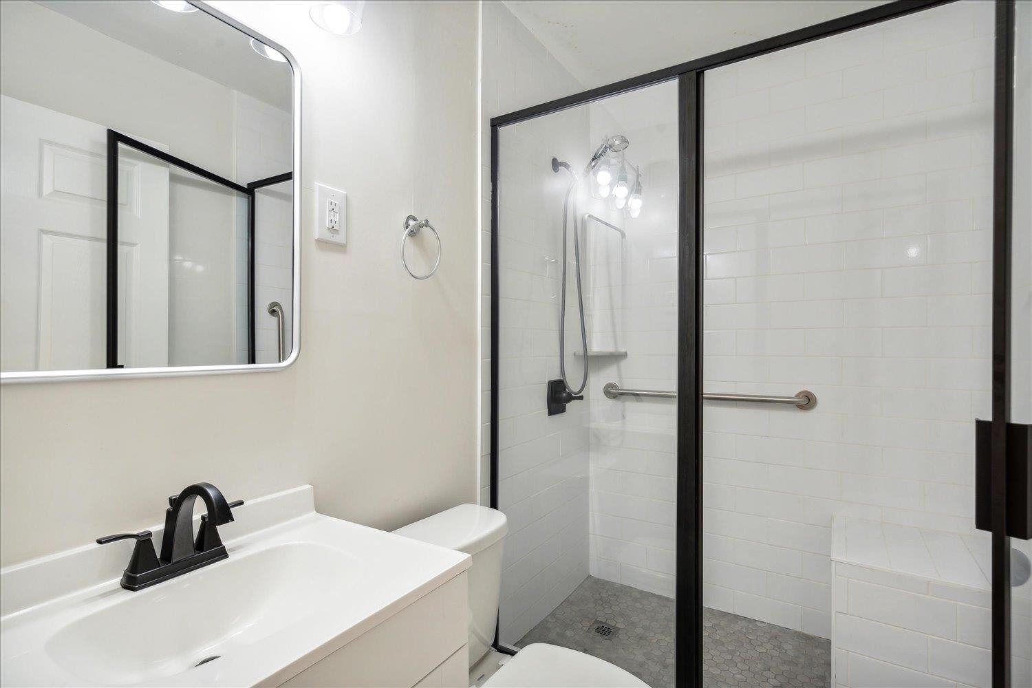 834 Greencliff Road Collierville, TN 38017 - Photo 9 of 20 a bathroom with a sink a toilet and shower