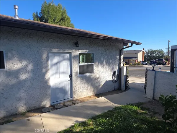 a front view of a house with yard