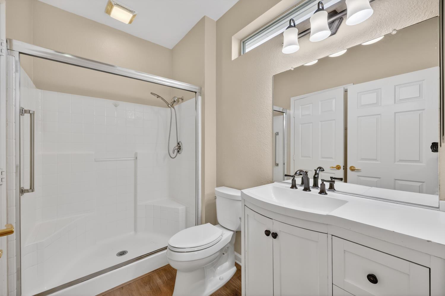 2272 Winding Way Lincoln, CA 95648 - Photo 14 of 46 a bathroom with a sink a toilet a mirror and shower