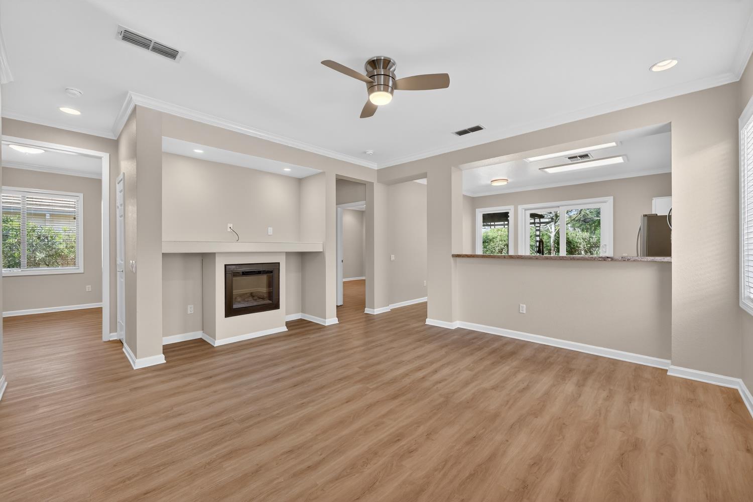2272 Winding Way Lincoln, CA 95648 - Photo 6 of 46 a view of an empty room with a fireplace and a window