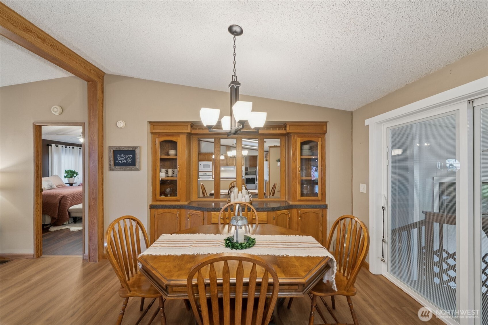 2350 Rincon Avenue Enumclaw, WA 98022 - Photo 13 of 31 a dining room with furniture a chandelier and wooden floor