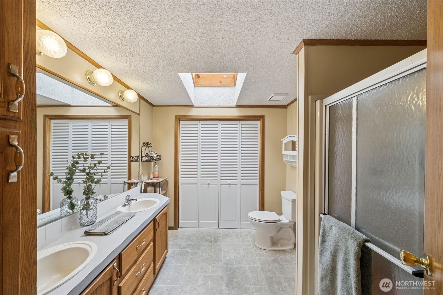 2350 Rincon Avenue Enumclaw, WA 98022 - Photo 20 of 31 a spacious bathroom with a granite countertop sink toilet and shower