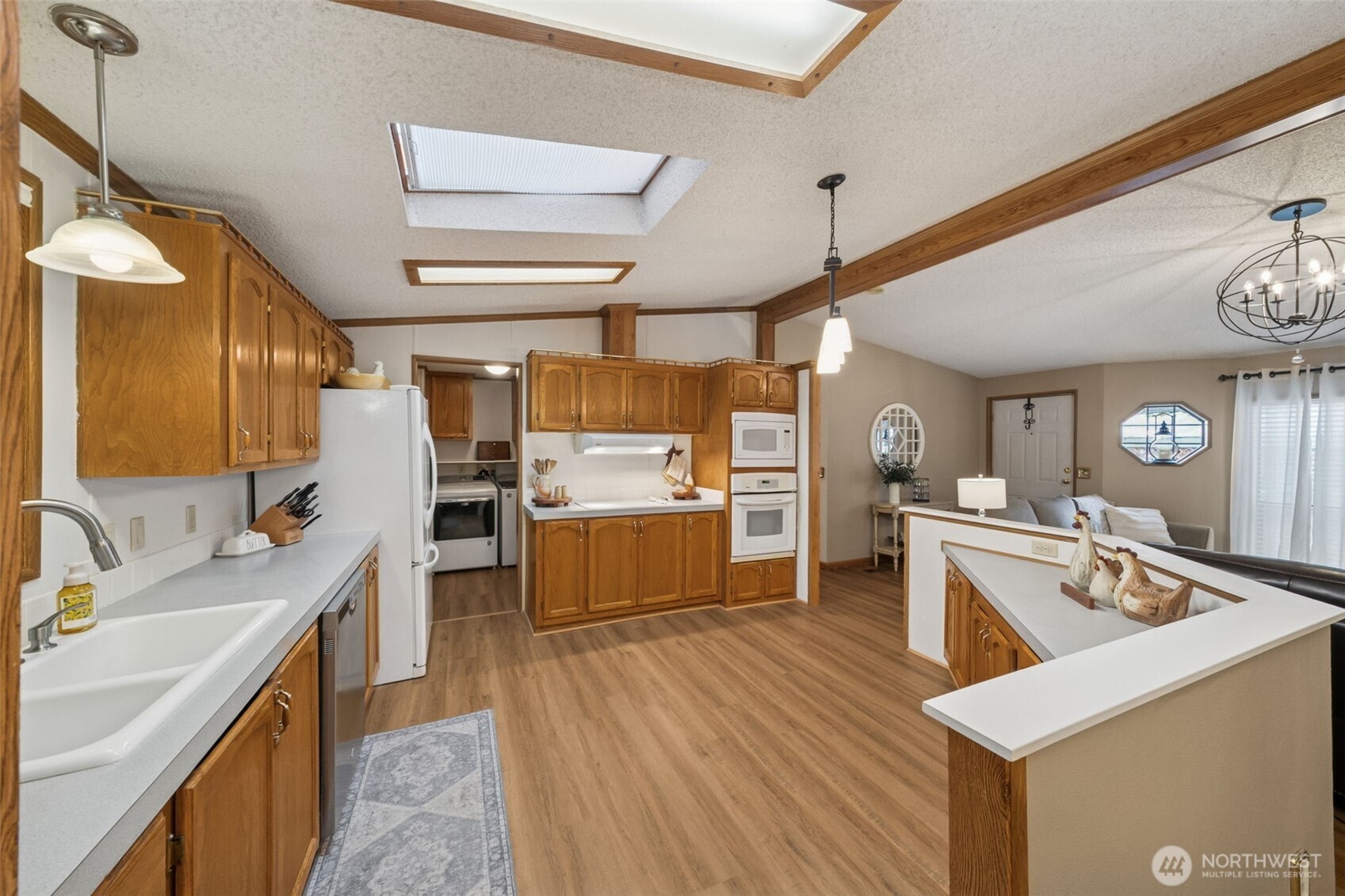 2350 Rincon Avenue Enumclaw, WA 98022 - Photo 9 of 31 a kitchen with a sink stove and cabinets