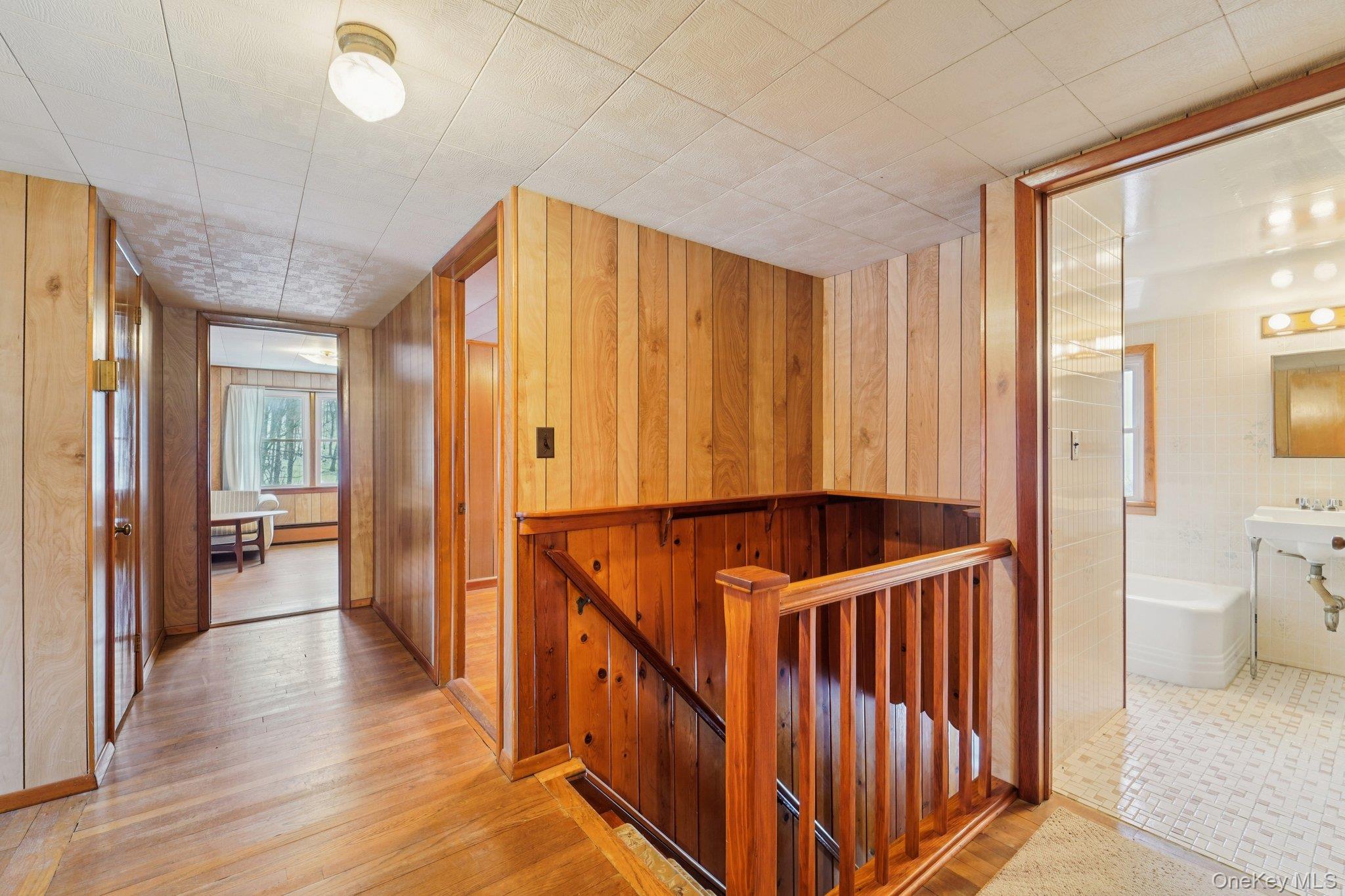350 Barrett Hill Road Mahopac, NY 10541 - Photo 13 of 21 a view of a hallway with bathroom and wooden floor