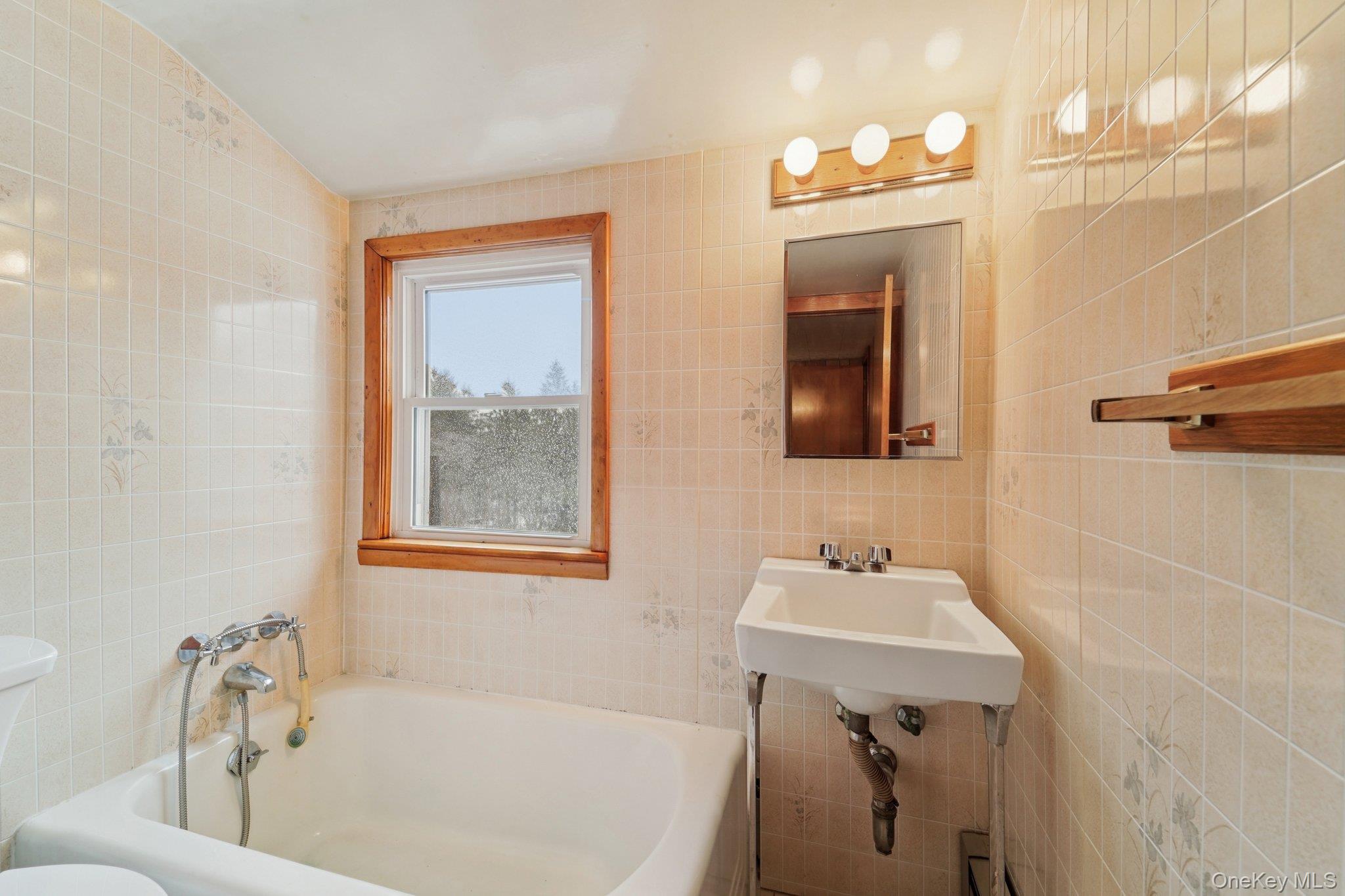 350 Barrett Hill Road Mahopac, NY 10541 - Photo 16 of 21 a bathroom with a sink tub and a mirror