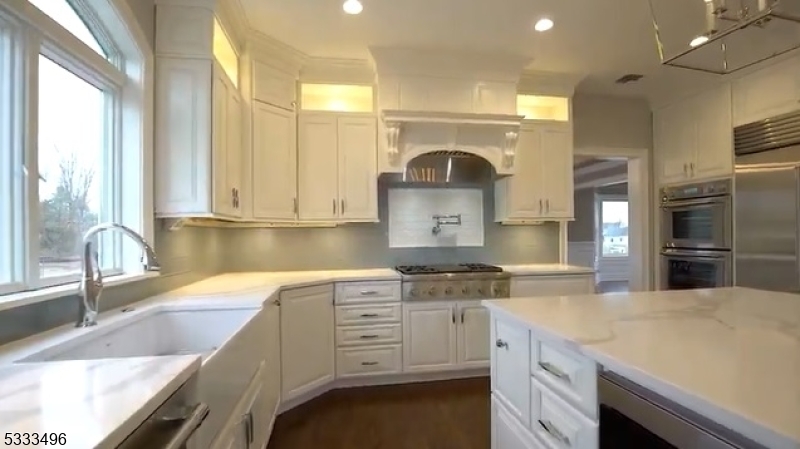 1831 Washington Valley Road Bridgewater, NJ 08836 - Photo 13 of 43 a kitchen with kitchen island granite countertop a sink stainless steel appliances and cabinets