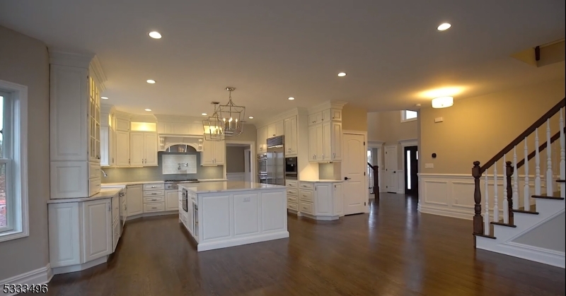 1831 Washington Valley Road Bridgewater, NJ 08836 - Photo 14 of 43 a view of a kitchen with cabinets and wooden floor